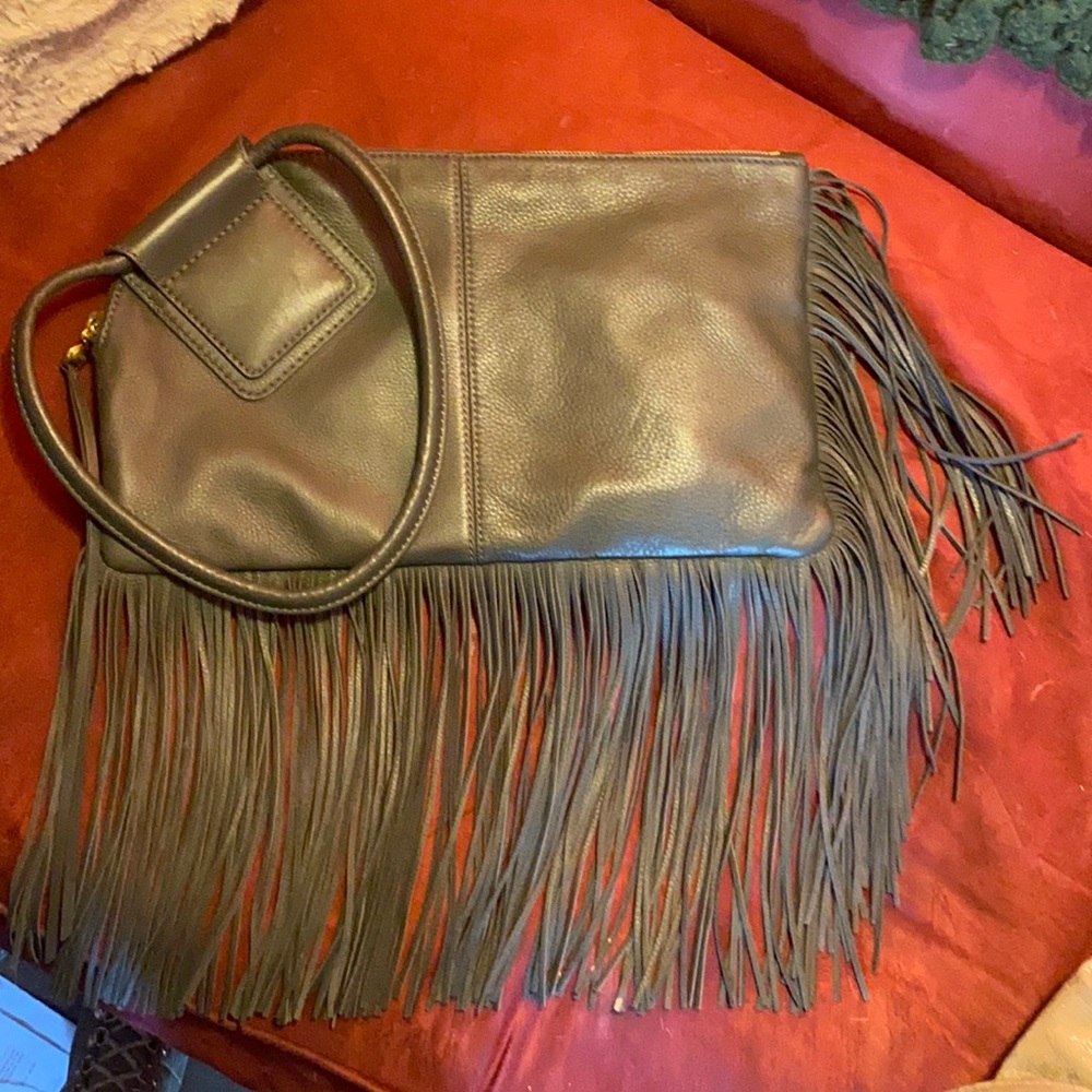Brand new used once Hobo brand olive green fringe bag with side pocket